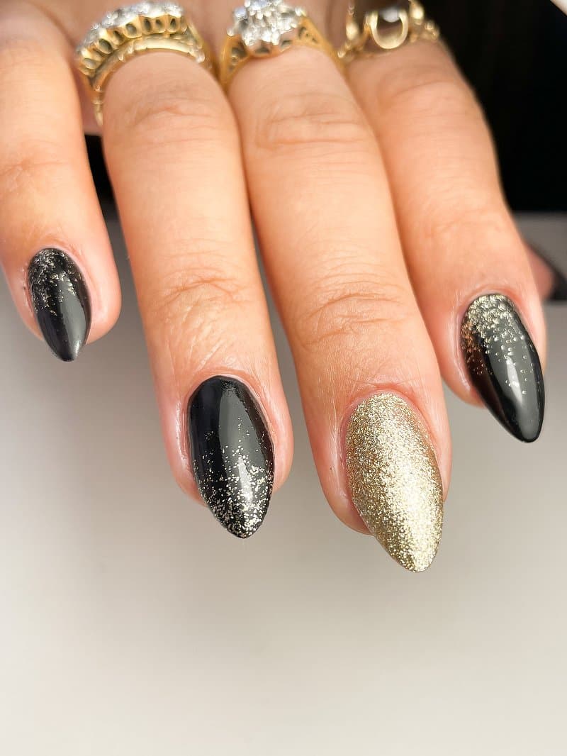 Black and gold gel nail design