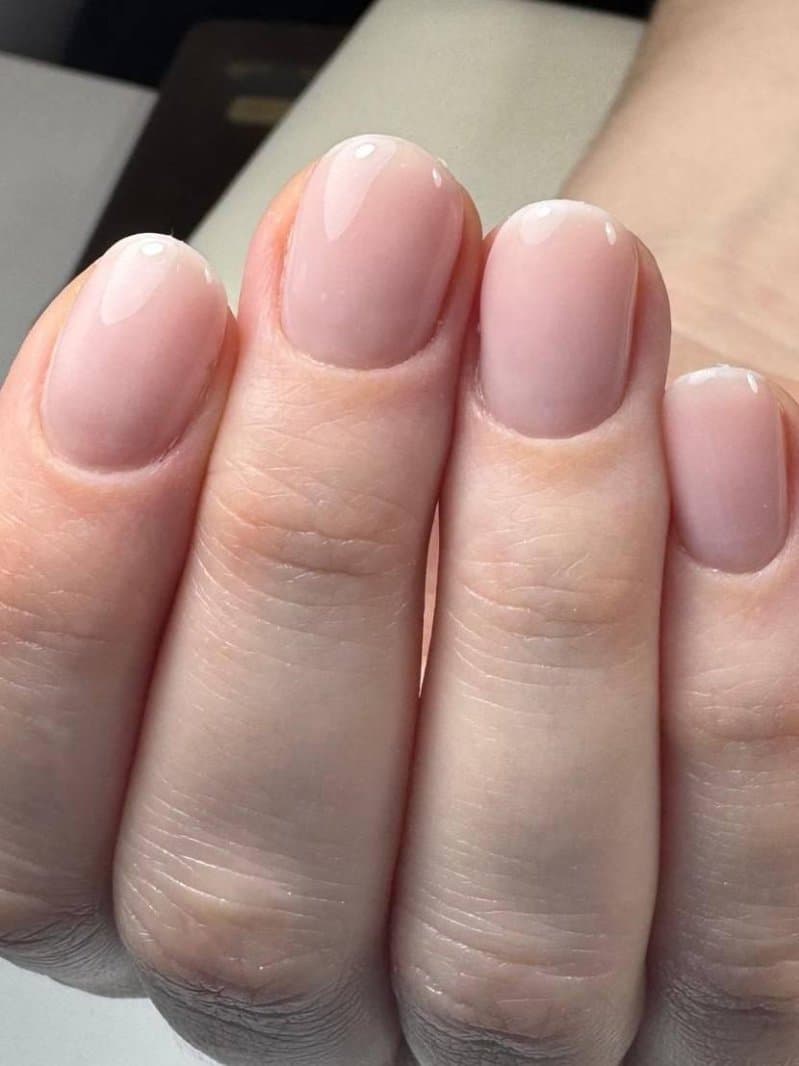 Pink nail art with floral detailing
