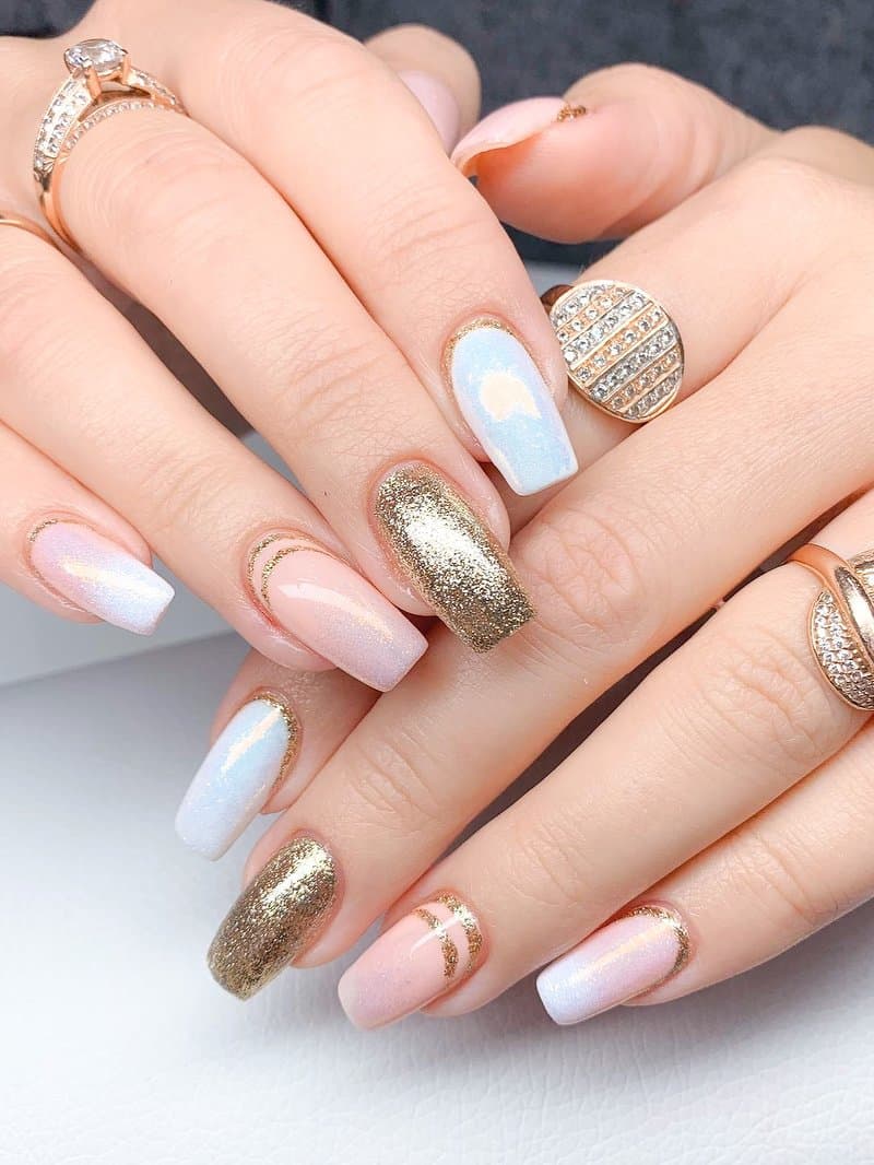 White and gold glitter gel nails